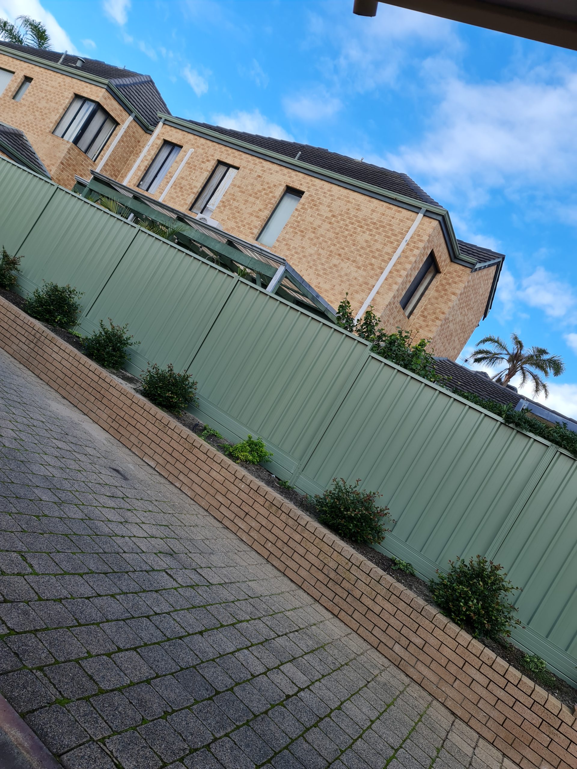 Fence installations in townhouses located in Perth, providing a practical and stylish solution for defining property boundaries and enhancing security and privacy. Depending on the specific needs and preferences of the property owner, a range of fence types can be installed, including Colorbond steel, timber, aluminum slat, glass pool, garrison, and tubular fencing. With a focus on safety, durability, and aesthetics, the fence installation team ensures that the fence is customized to suit the unique requirements of each townhouse, enhancing its value and functionality.