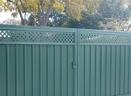 A green gate installed in Perth, providing a stylish and secure entrance to the property. The gate features a sleek design with clean lines and a smooth finish, and is made of durable materials such as Colorbond steel or aluminum. The green color adds a touch of personality and complements the surrounding landscape or house exterior. The gate can be customized to fit any size or shape of the entrance, providing a functional and attractive addition to the property